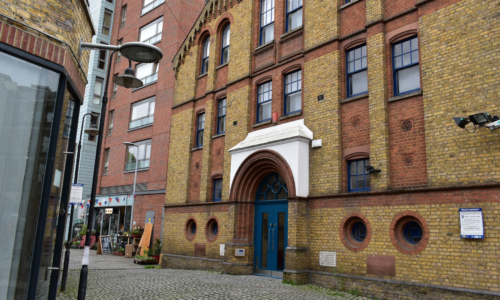 Exterior of building with blue windows and door