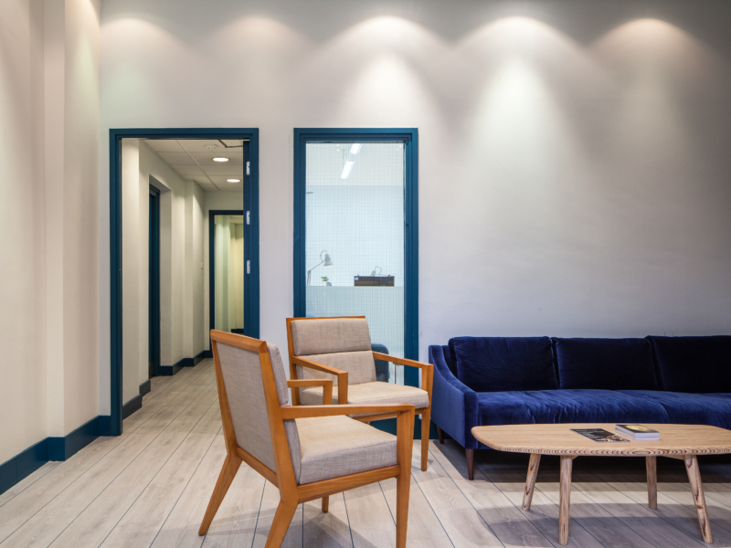 Sofa, coffee table and two chairs in the centre of a room