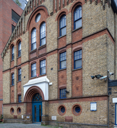 Exterior of building with blue windows and door