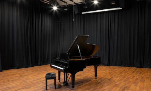 A grand piano in the national opera studio blackburn hall, available for hire